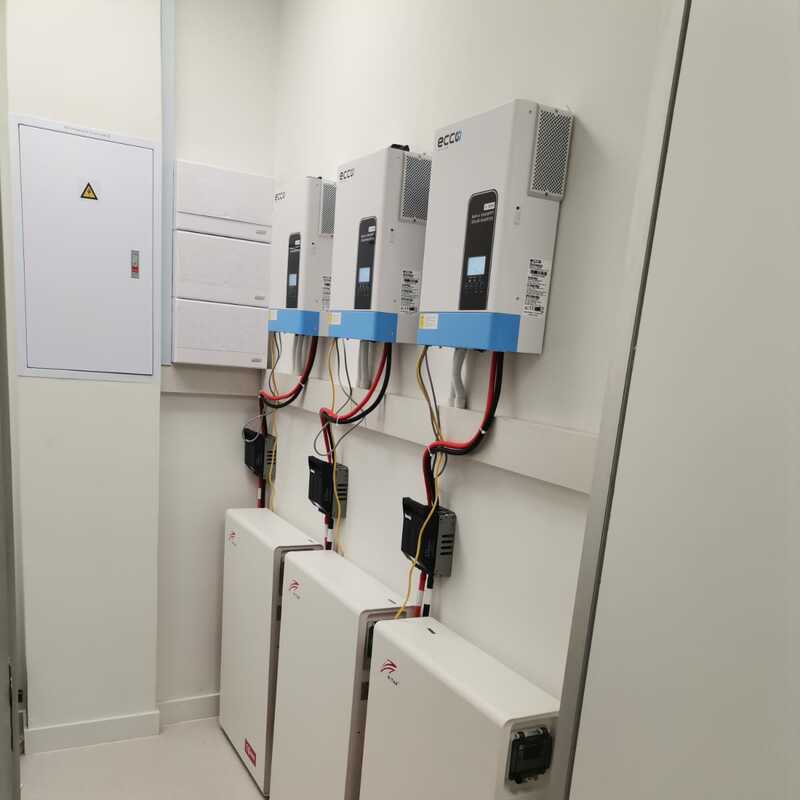 Skilled electrician from VoltedgeElectric installing modern lighting fixtures in a residential living room.